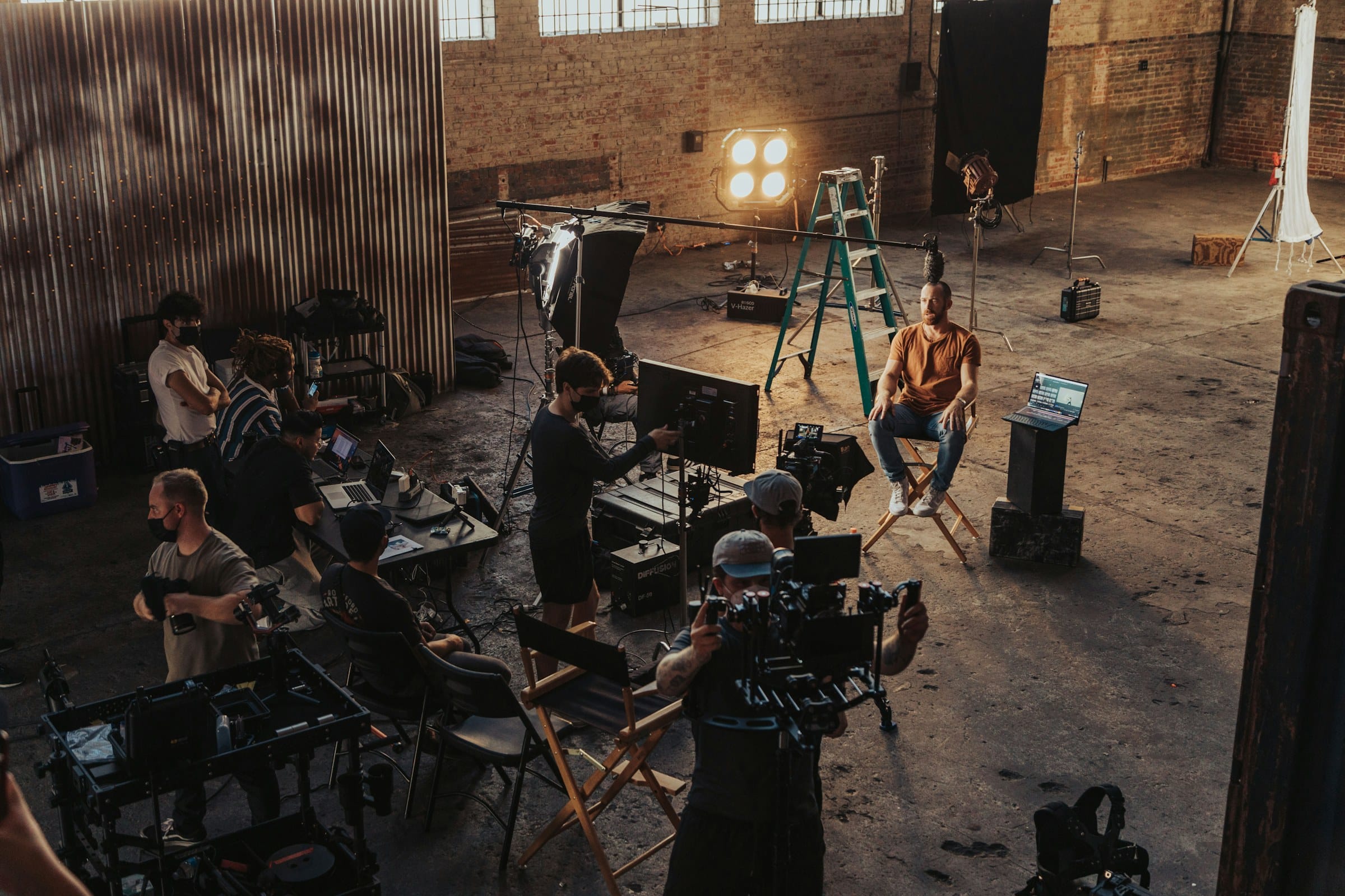Film crew working on a warehouse set