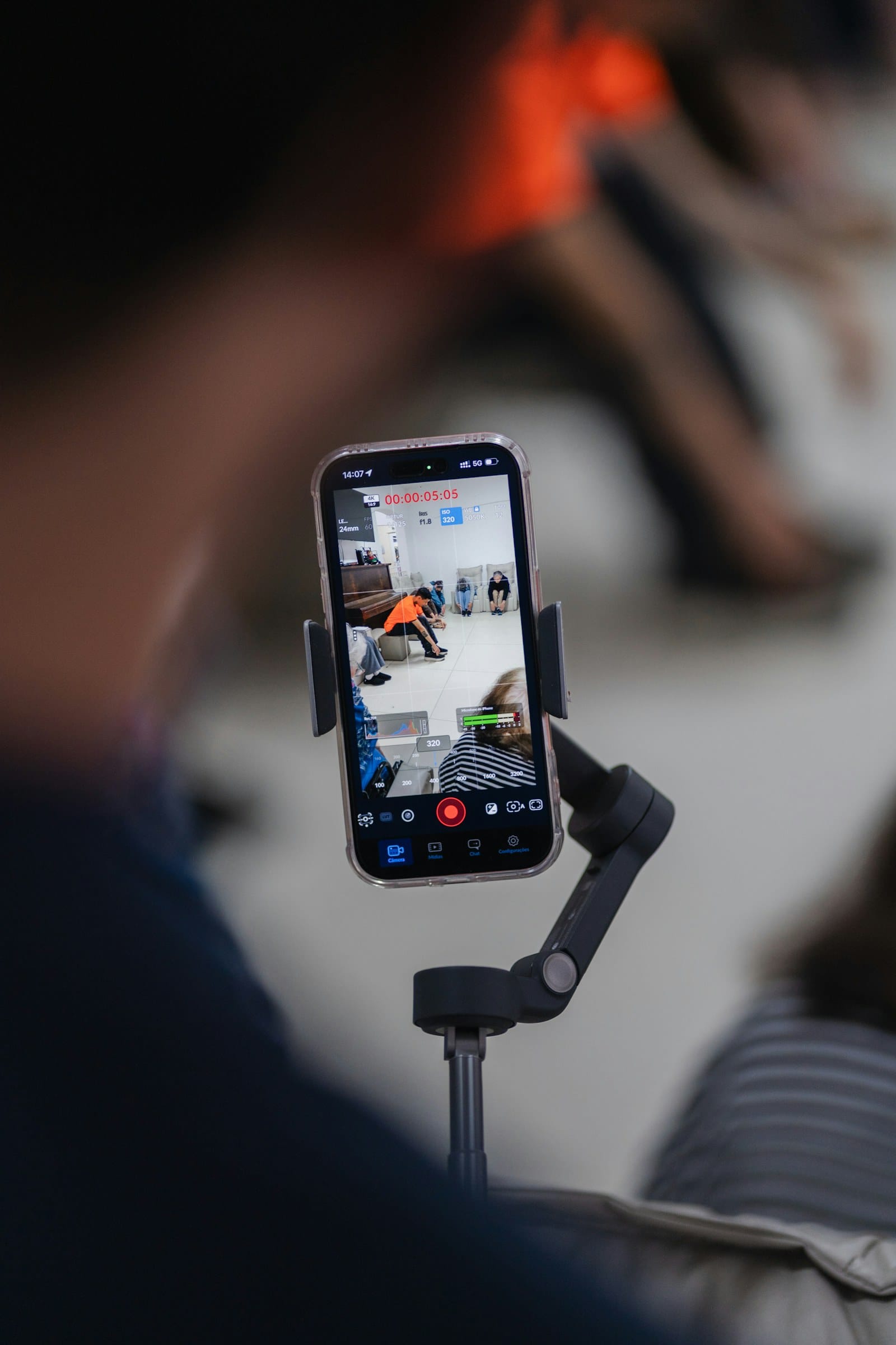 Person recording a live video on a smartphone