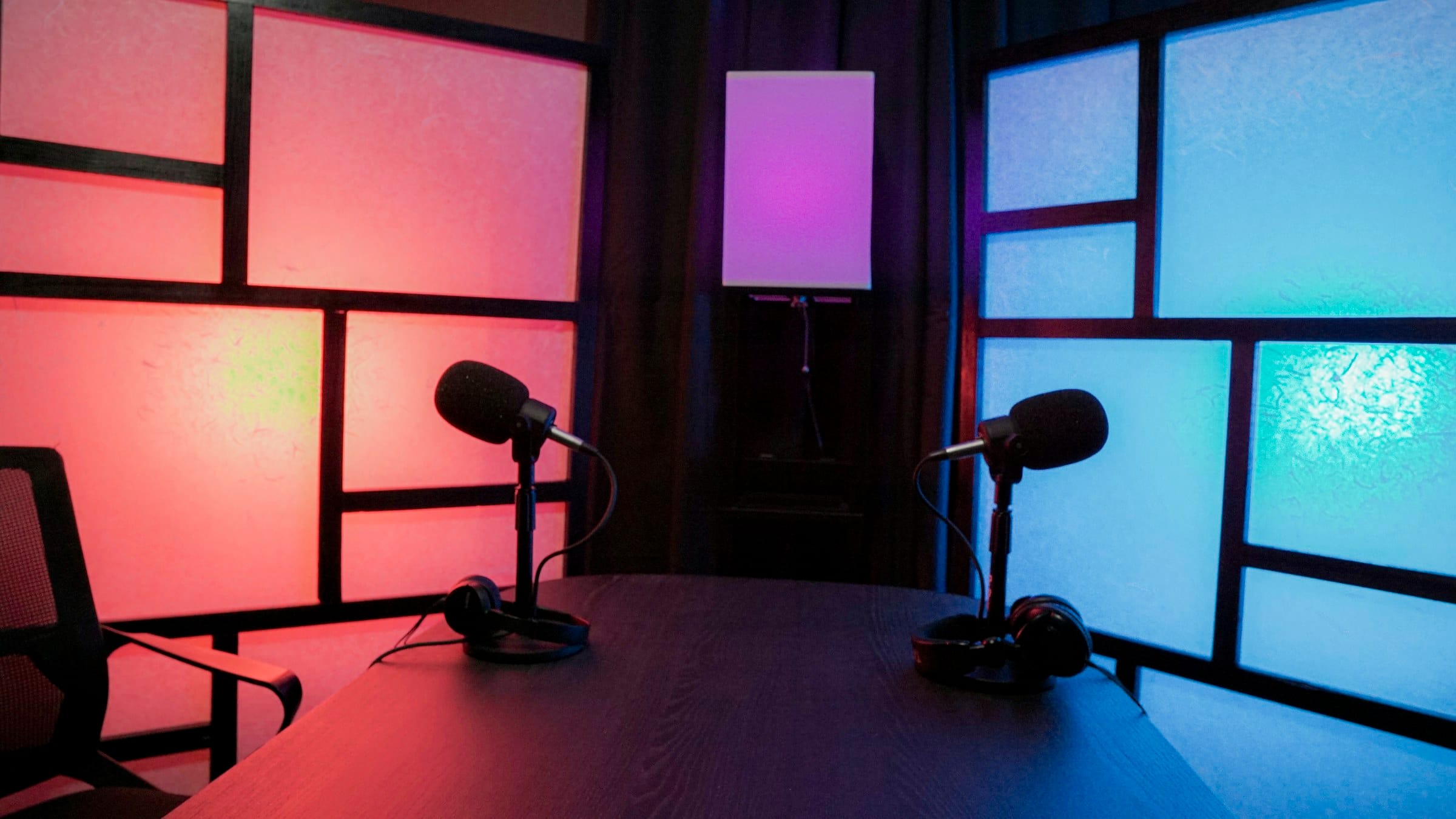 Podcast set with coloured light panels